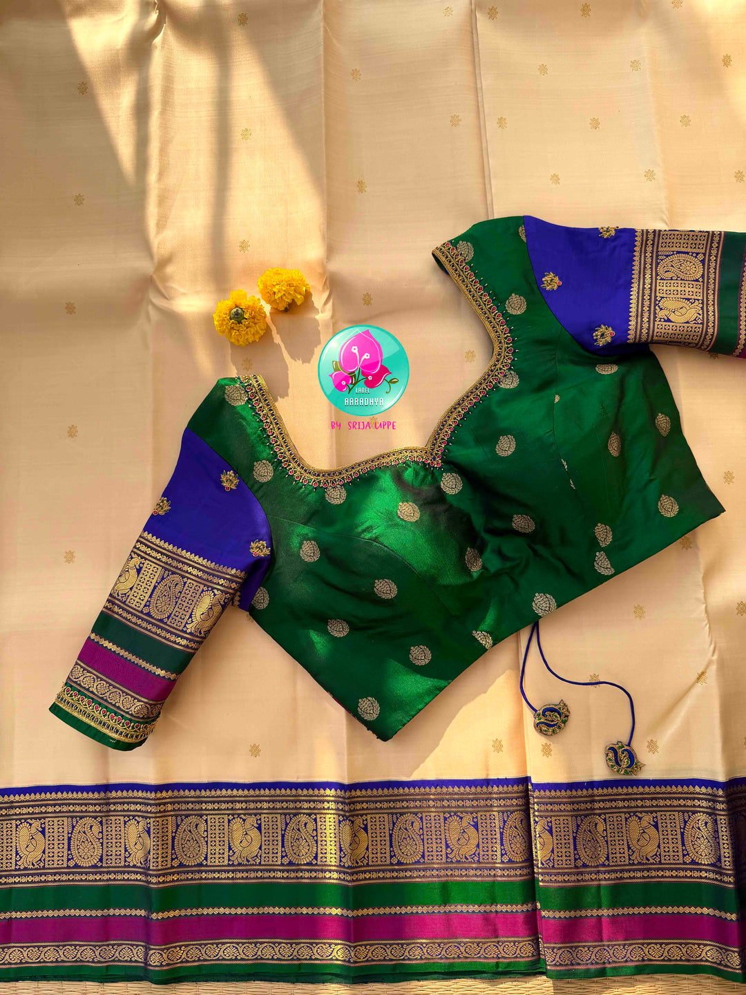 Understated Ivory Regalism: Cream Kanchipattu Silk Saree with Multi-Tone Heritage Border & Designer Maggam Blouse