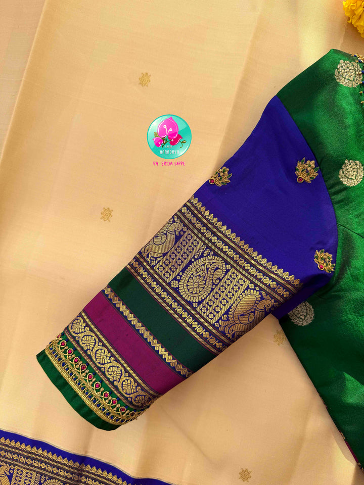 Understated Ivory Regalism: Cream Kanchipattu Silk Saree with Multi-Tone Heritage Border & Designer Maggam Blouse