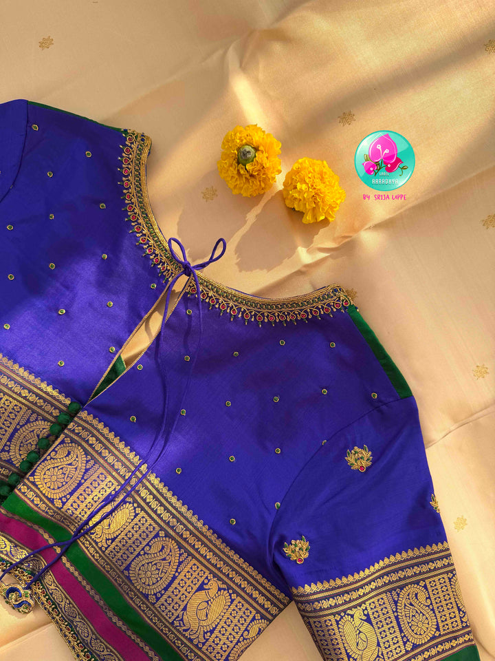 Understated Ivory Regalism: Cream Kanchipattu Silk Saree with Multi-Tone Heritage Border & Designer Maggam Blouse