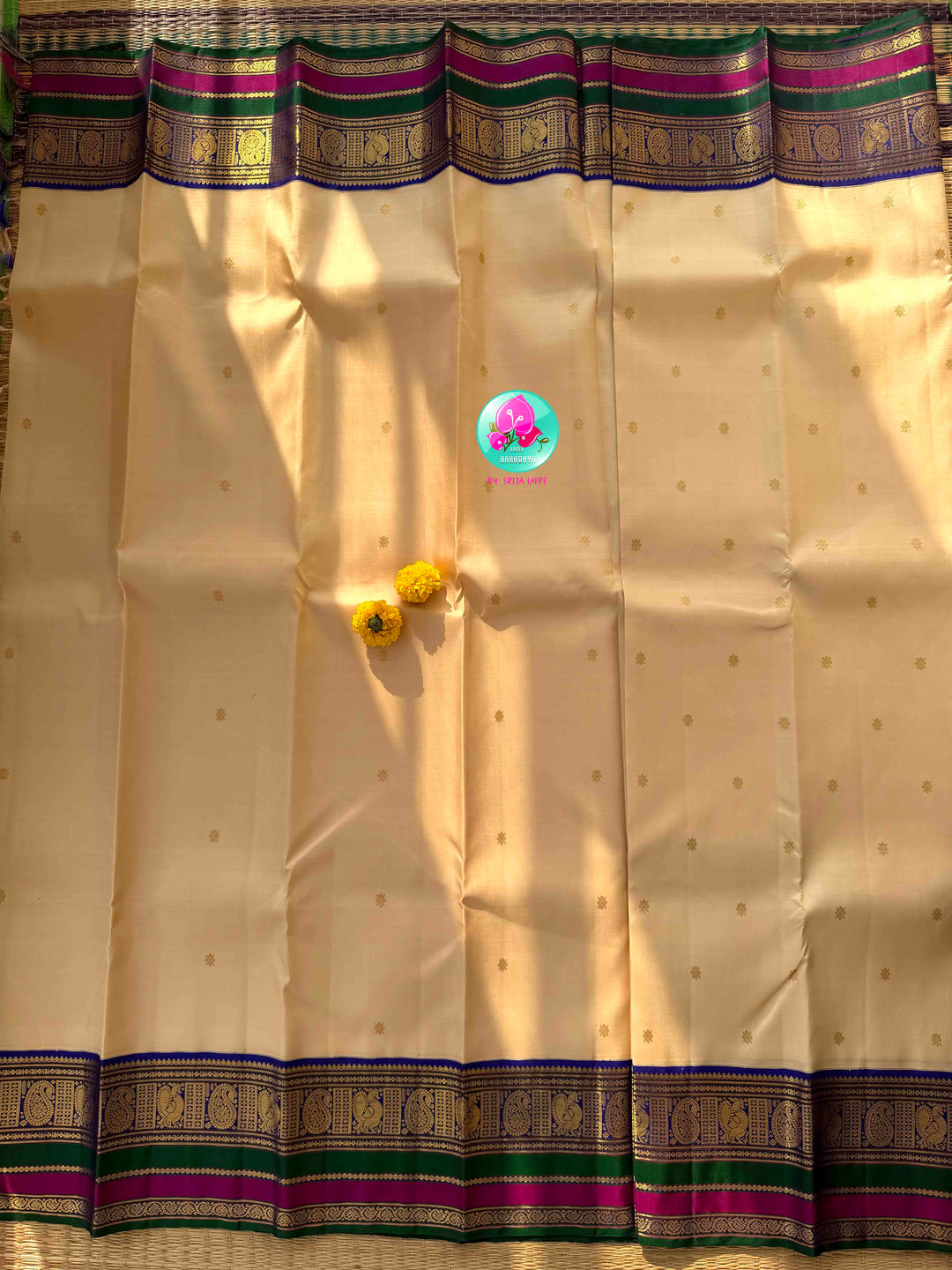 Understated Ivory Regalism: Cream Kanchipattu Silk Saree with Multi-Tone Heritage Border & Designer Maggam Blouse