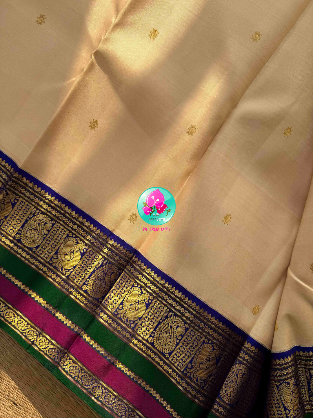 Understated Ivory Regalism: Cream Kanchipattu Silk Saree with Multi-Tone Heritage Border & Designer Maggam Blouse
