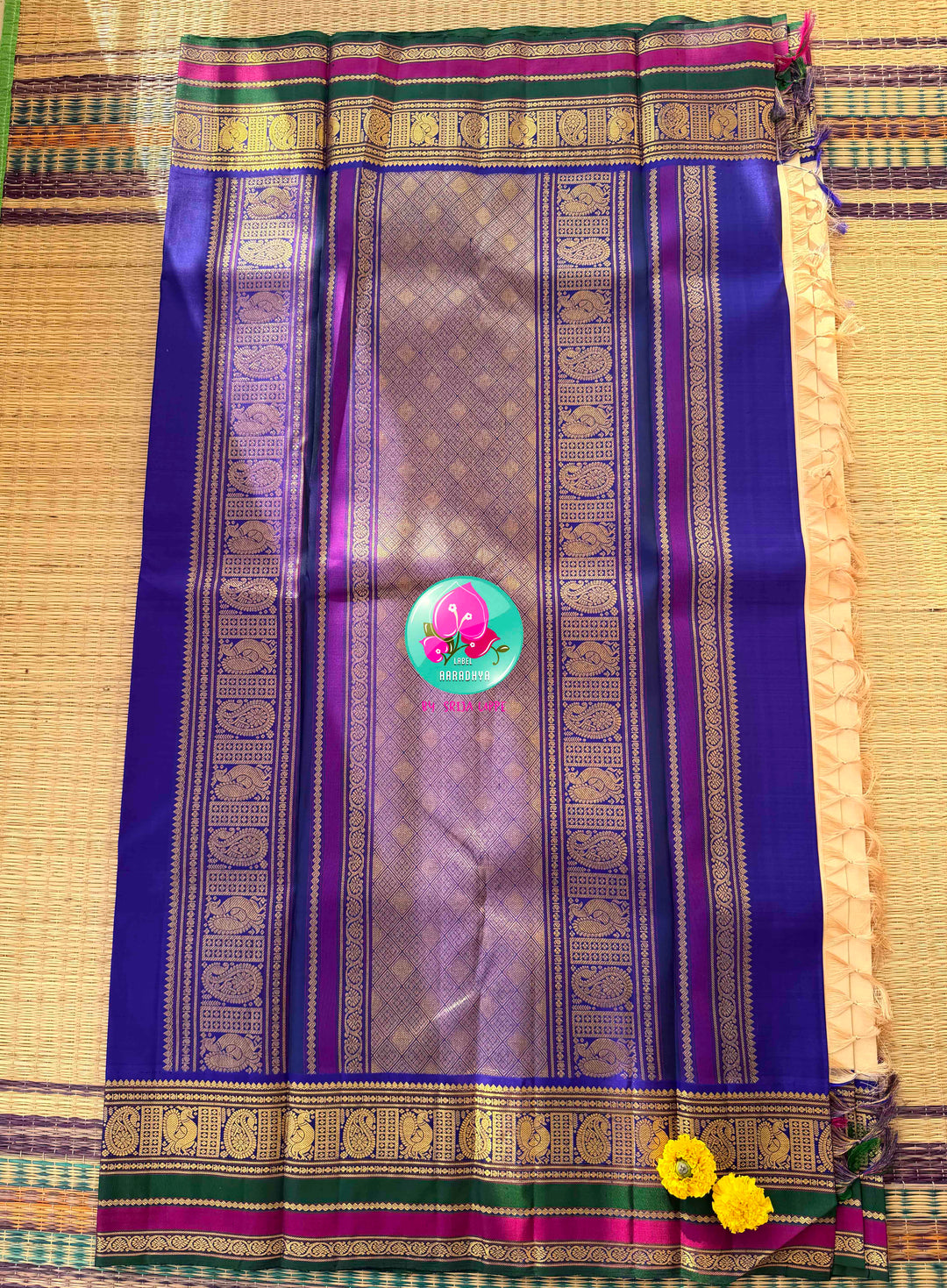 Understated Ivory Regalism: Cream Kanchipattu Silk Saree with Multi-Tone Heritage Border & Designer Maggam Blouse