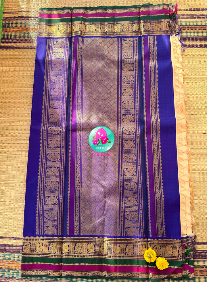 Understated Ivory Regalism: Cream Kanchipattu Silk Saree with Multi-Tone Heritage Border & Designer Maggam Blouse