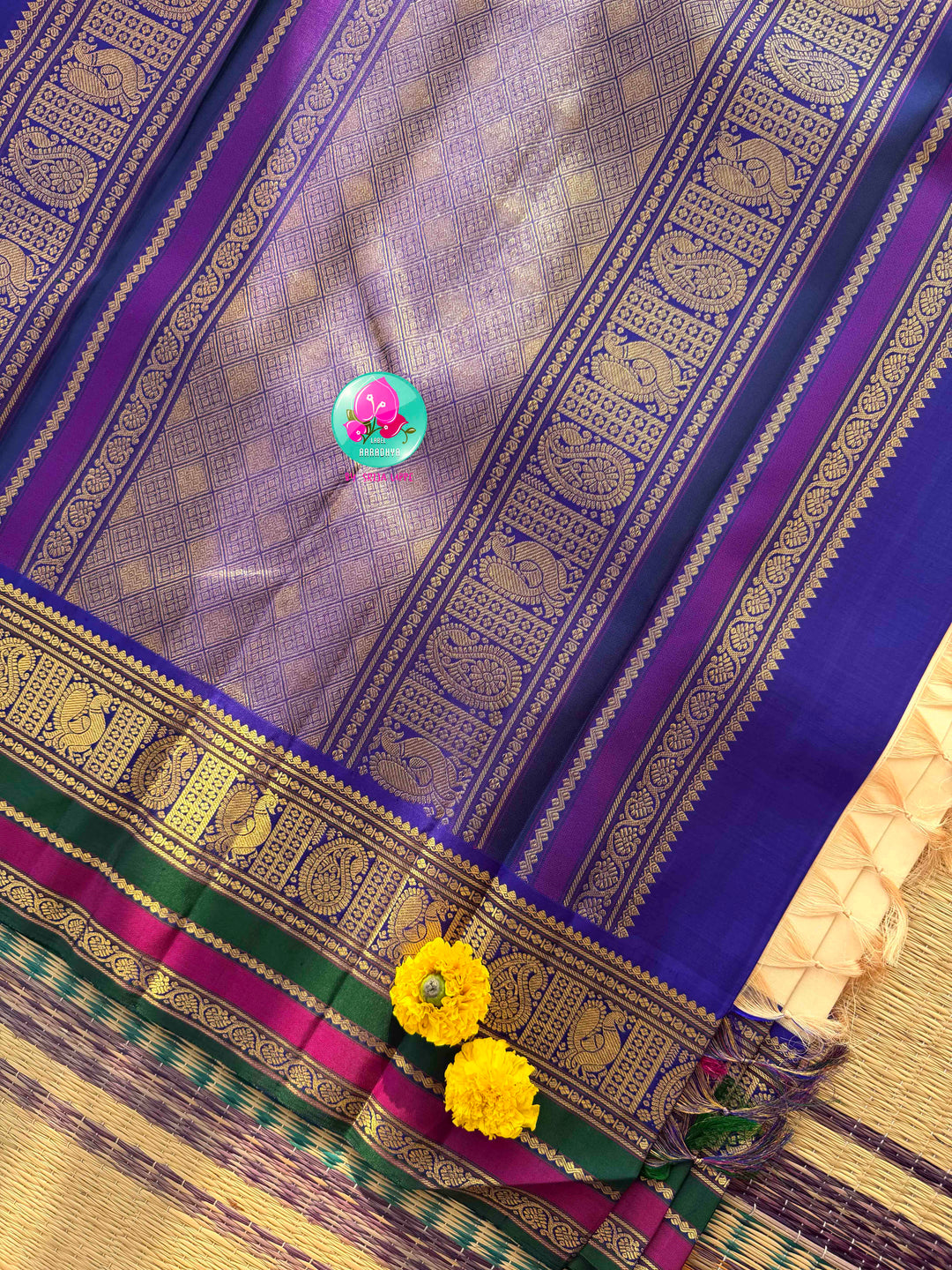 Understated Ivory Regalism: Cream Kanchipattu Silk Saree with Multi-Tone Heritage Border & Designer Maggam Blouse