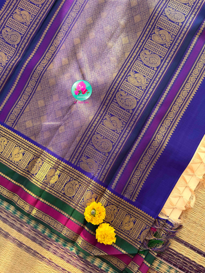 Understated Ivory Regalism: Cream Kanchipattu Silk Saree with Multi-Tone Heritage Border & Designer Maggam Blouse