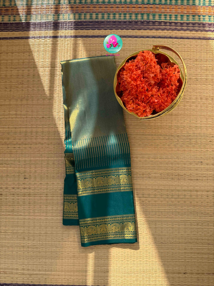 Jewel-Toned Metallic Grace: Teal Green 2G Pure Kanchipattu Tissue Saree with Traditional Gap Border