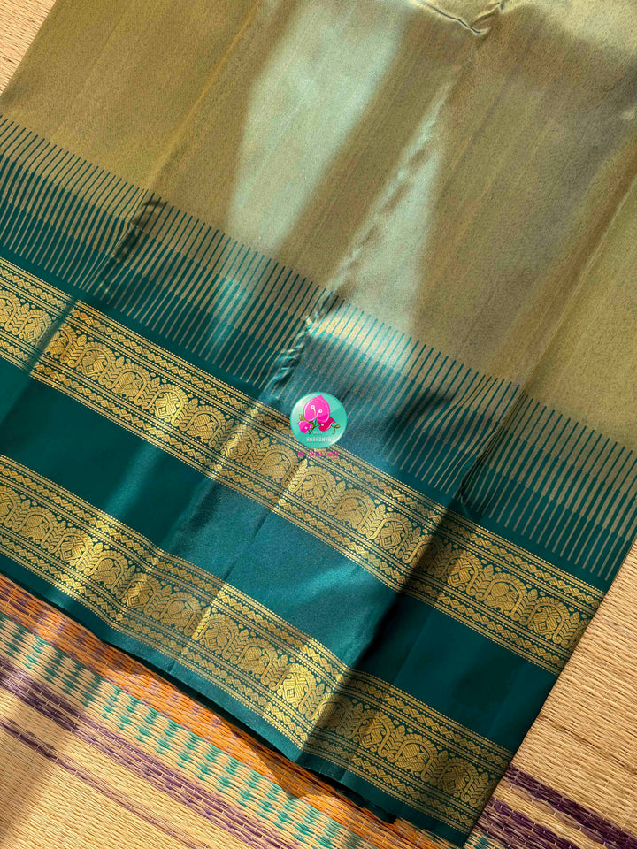 Jewel-Toned Metallic Grace: Teal Green 2G Pure Kanchipattu Tissue Saree with Traditional Gap Border