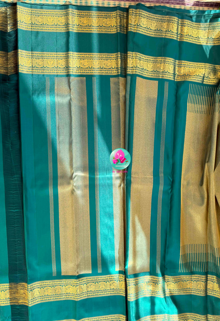 Jewel-Toned Metallic Grace: Teal Green 2G Pure Kanchipattu Tissue Saree with Traditional Gap Border