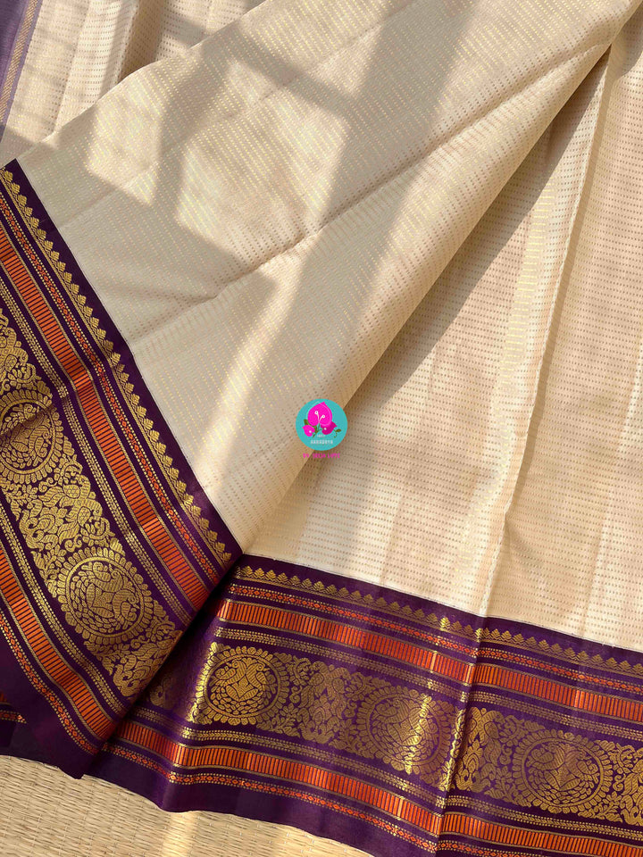 Regal Serenity: Ivory Kanjivaram Saree in Vaira Oosi with Royal Purple Contrast