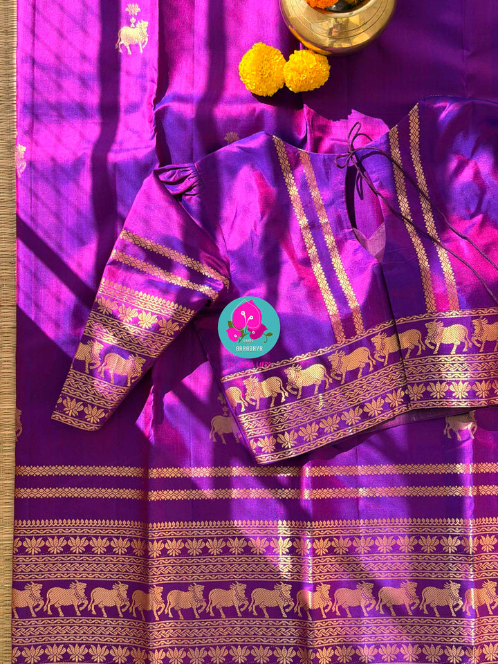 Ethereal Radiance: Dual-Tone Violet Kanchipattu with Antique Zari & Sacred Nandhini Motifs