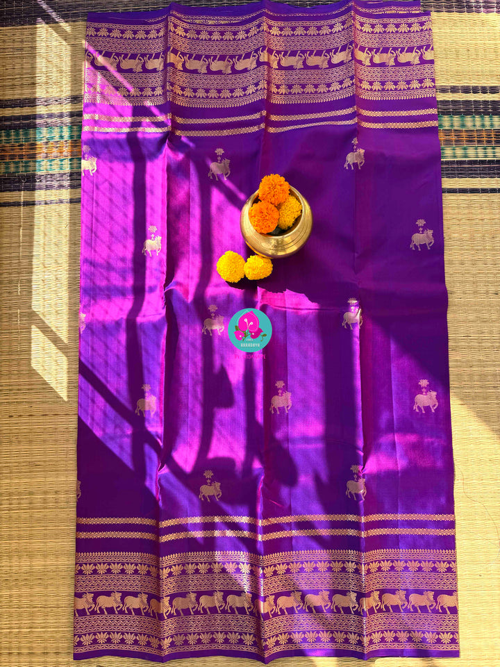 Ethereal Radiance: Dual-Tone Violet Kanchipattu with Antique Zari & Sacred Nandhini Motifs
