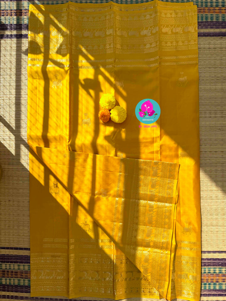 The Gilded Radiance: Yellow Kanchi Silk with Sacred Nandhini Motifs