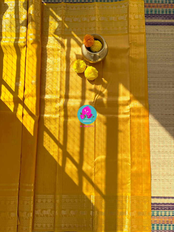 The Gilded Radiance: Yellow Kanchi Silk with Sacred Nandhini Motifs