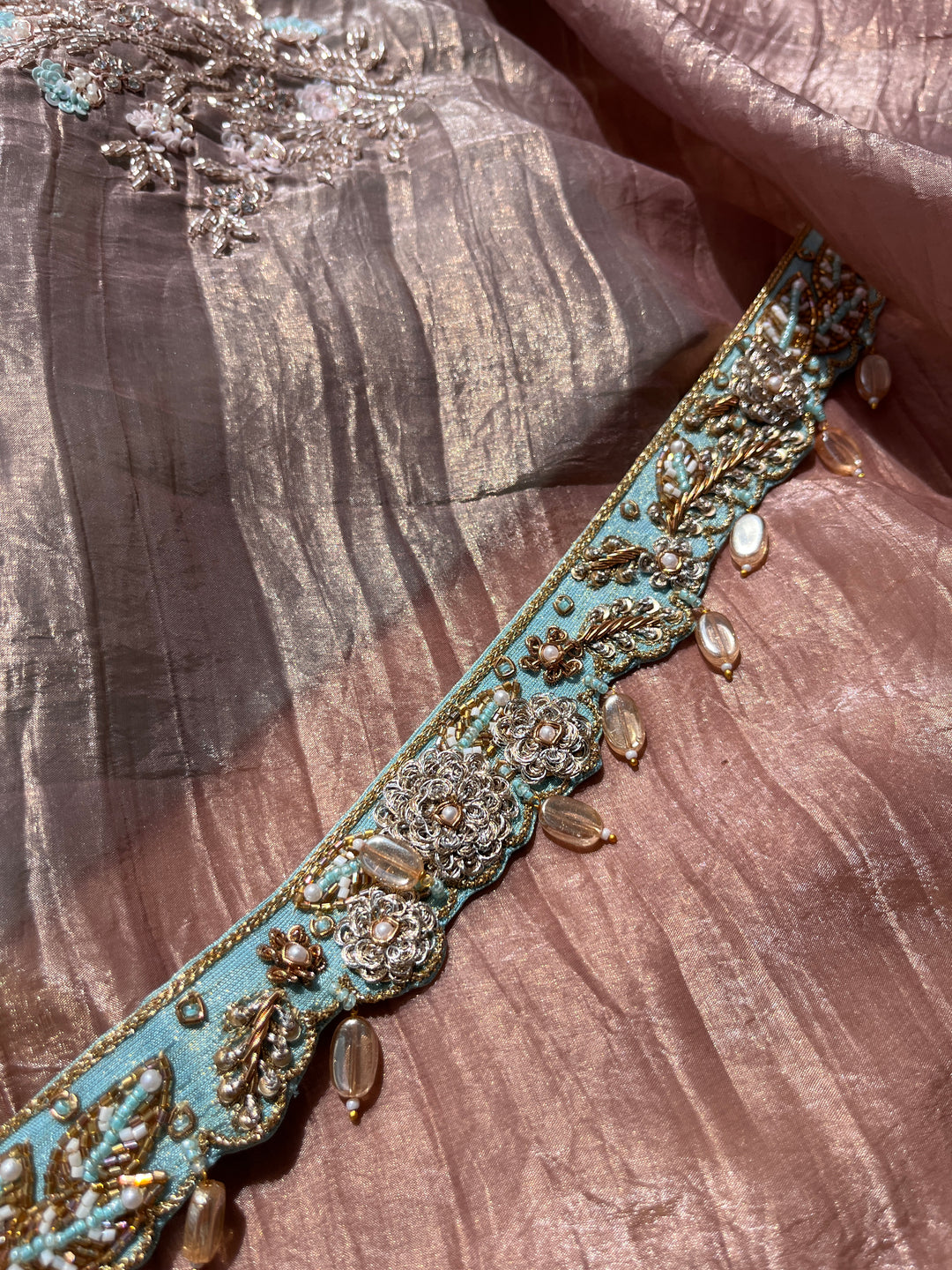 Hand embroidered soft crush organza saree paired with hand embroidered Blouse & Belt