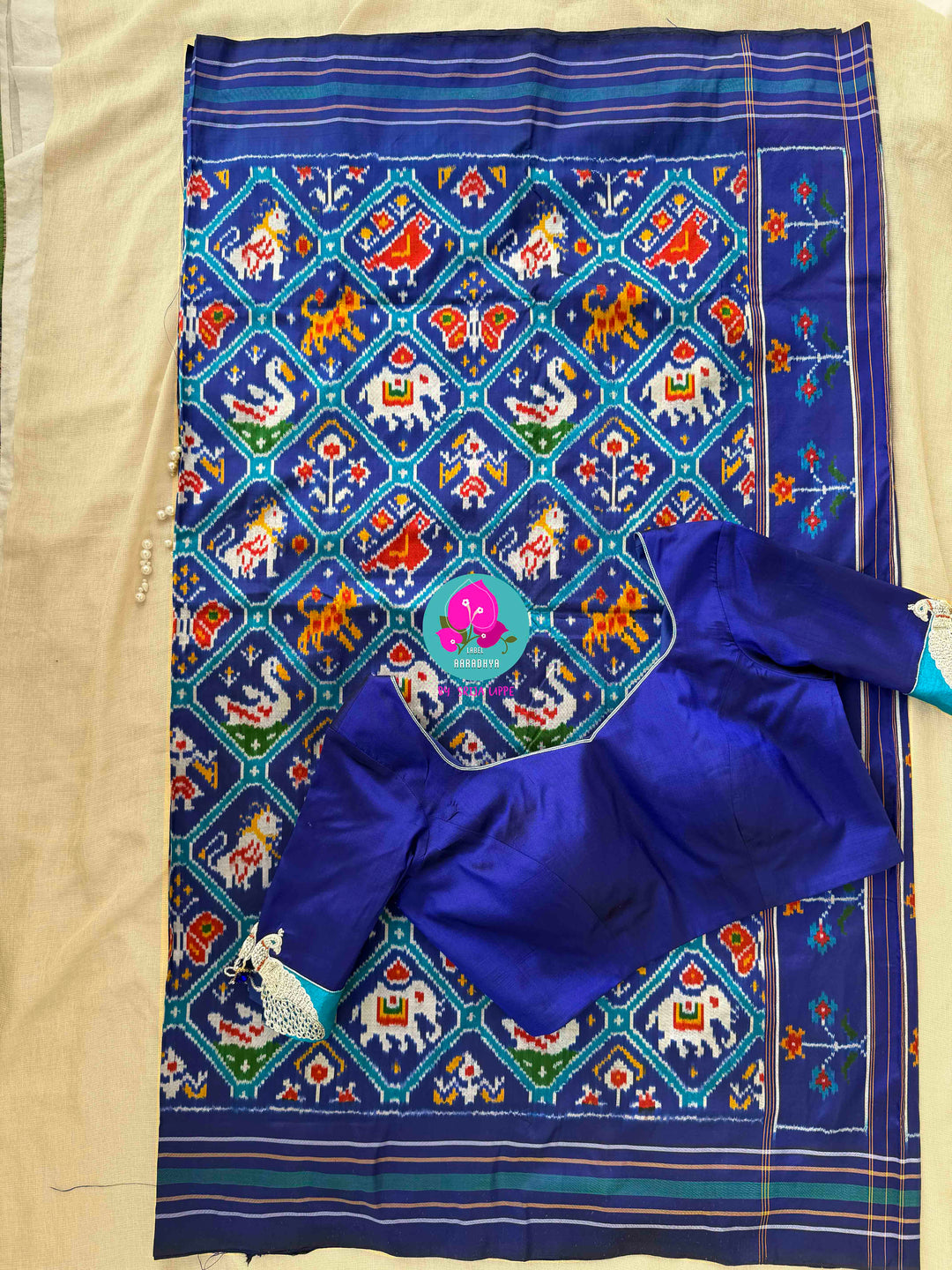 The Azure Odyssey: Royal Blue Double Ikkat Patola with Artisan Peacock Artistry