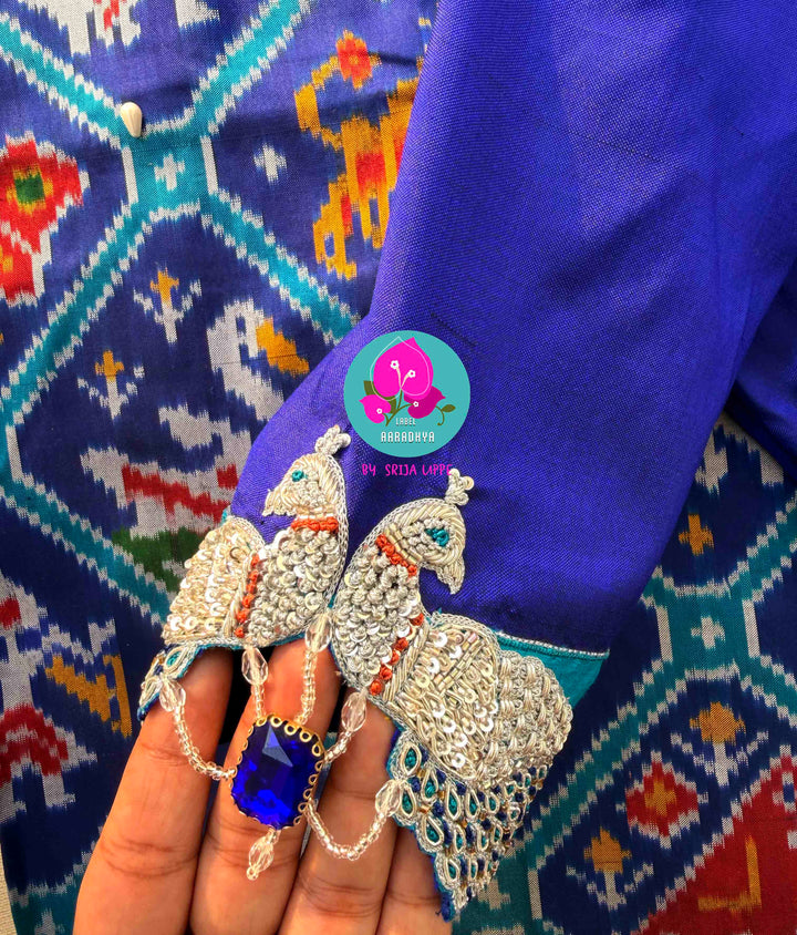 The Azure Odyssey: Royal Blue Double Ikkat Patola with Artisan Peacock Artistry