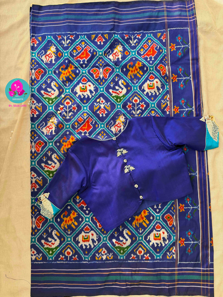 The Azure Odyssey: Royal Blue Double Ikkat Patola with Artisan Peacock Artistry