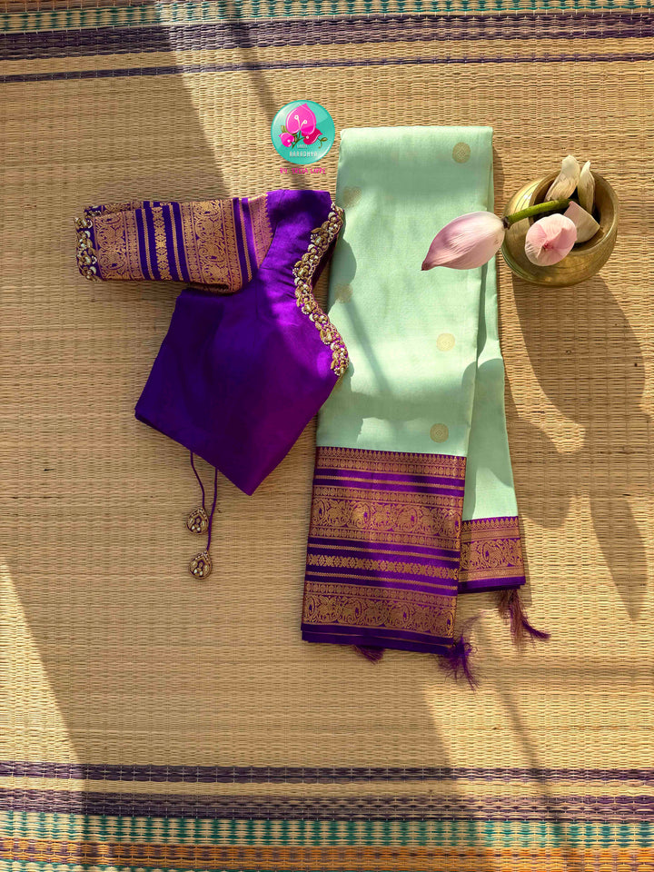 Pastel Serenity & Amethyst Majesty: Lux Green Pure Kanchipattu Saree with Royal Purple Border & Hand-Embroidered Maggam Blouse