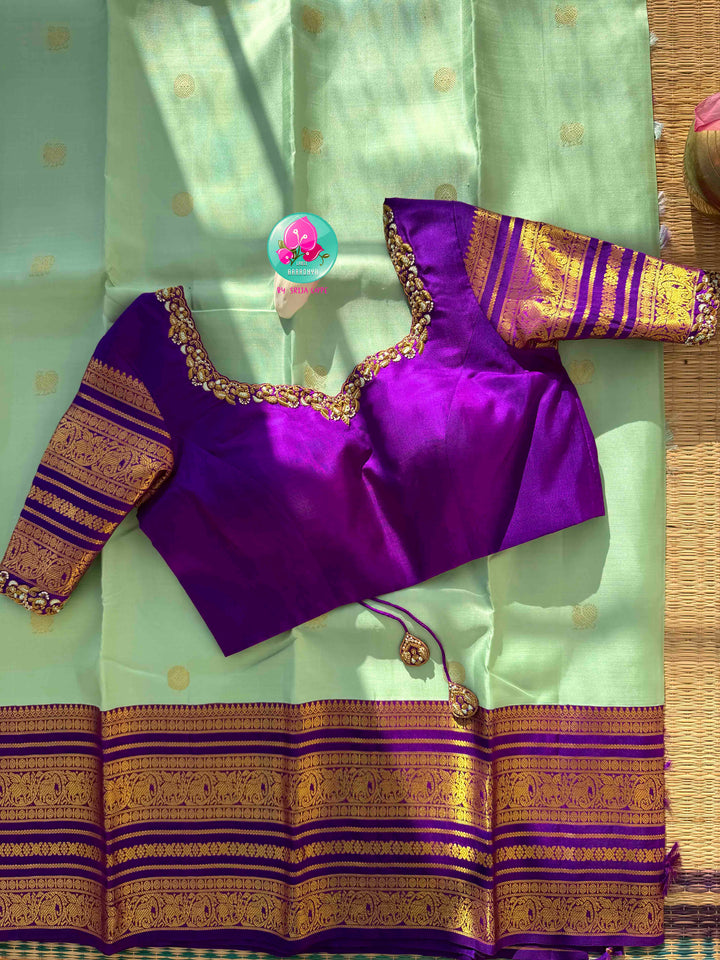 Pastel Serenity & Amethyst Majesty: Lux Green Pure Kanchipattu Saree with Royal Purple Border & Hand-Embroidered Maggam Blouse