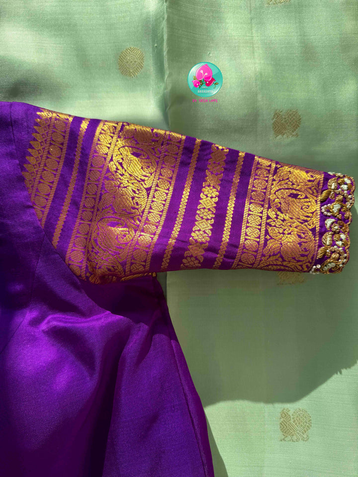 Pastel Serenity & Amethyst Majesty: Lux Green Pure Kanchipattu Saree with Royal Purple Border & Hand-Embroidered Maggam Blouse