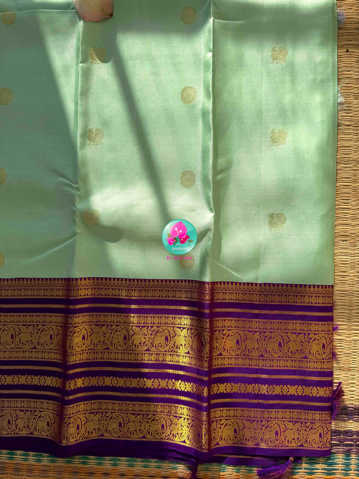 Pastel Serenity & Amethyst Majesty: Lux Green Pure Kanchipattu Saree with Royal Purple Border & Hand-Embroidered Maggam Blouse