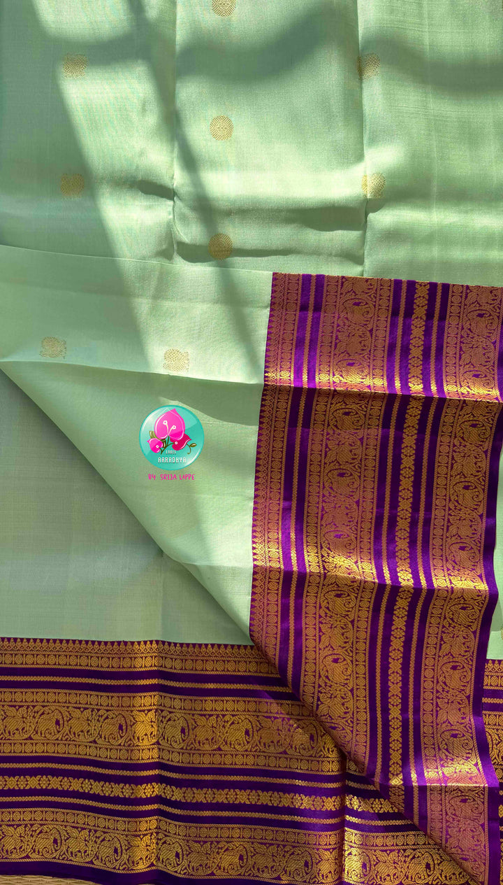 Pastel Serenity & Amethyst Majesty: Lux Green Pure Kanchipattu Saree with Royal Purple Border & Hand-Embroidered Maggam Blouse