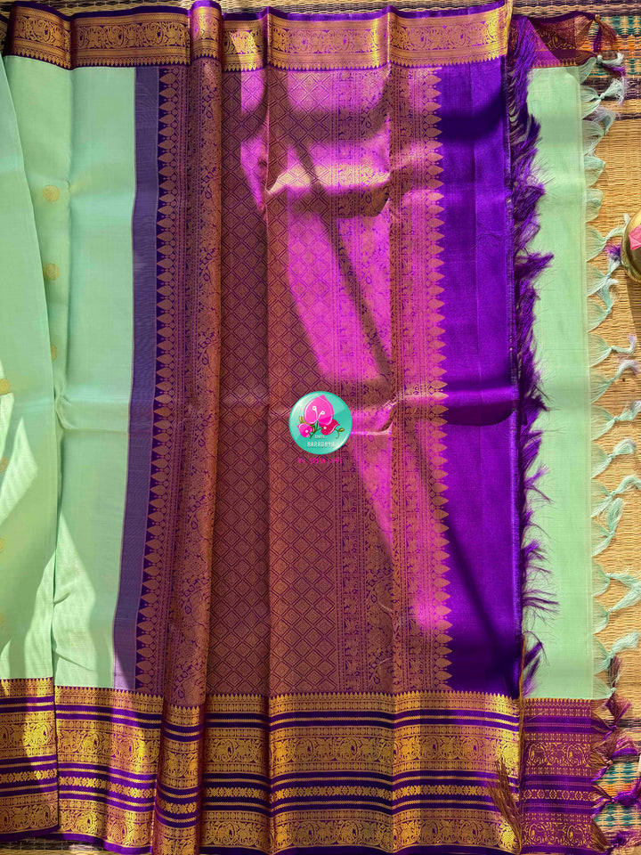 Pastel Serenity & Amethyst Majesty: Lux Green Pure Kanchipattu Saree with Royal Purple Border & Hand-Embroidered Maggam Blouse