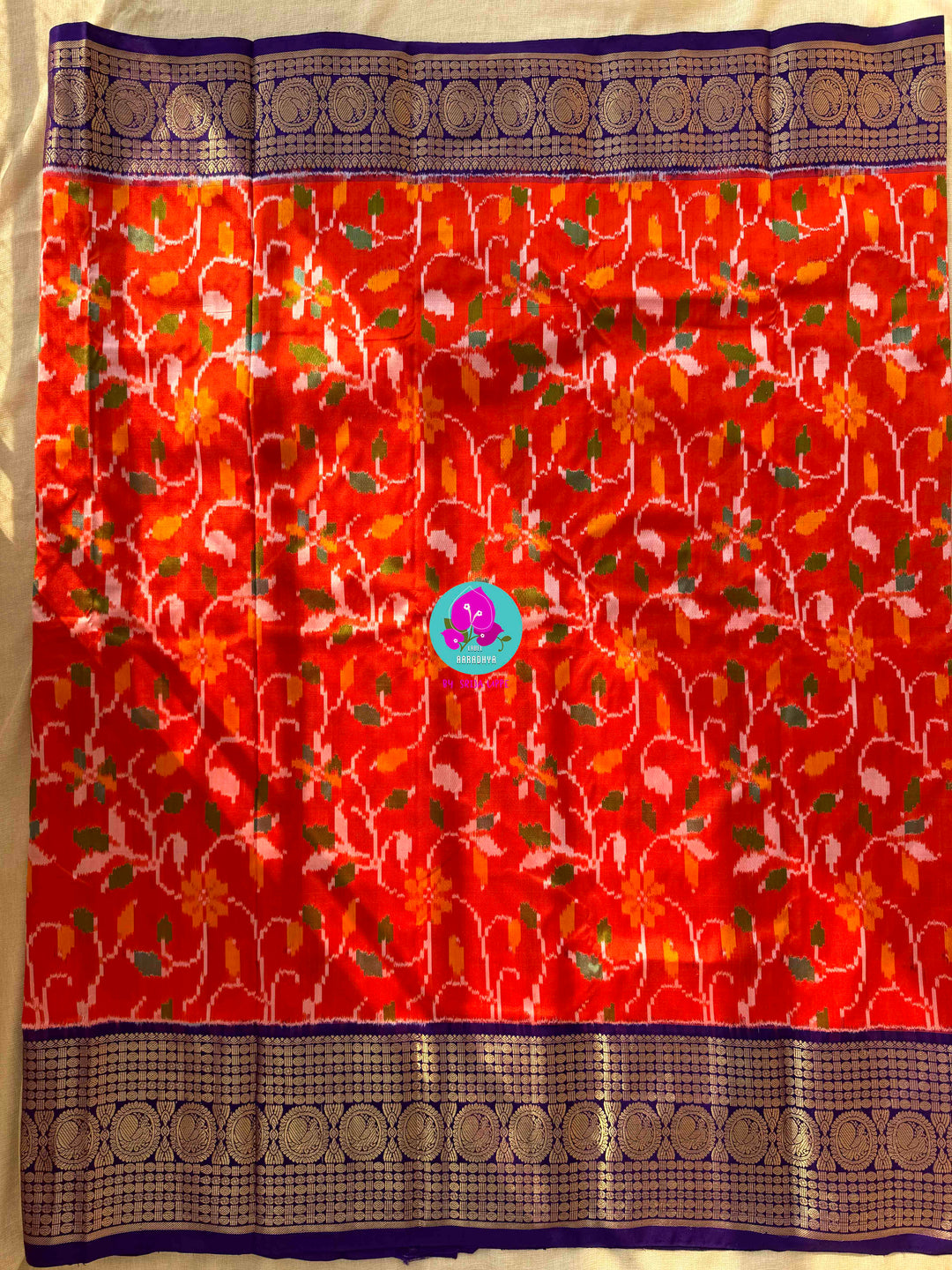 Pure Orange Ikkat Silk Saree with zari on Purple border