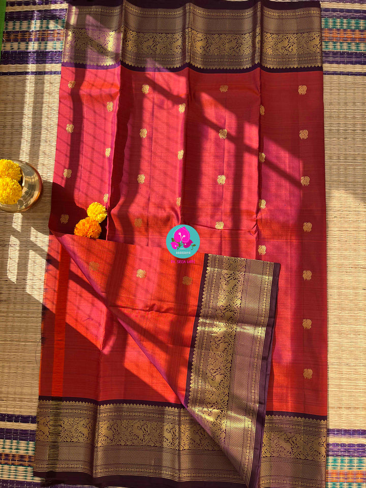 Fiery Passion & Regal Plum: Dual-Tone Kanjivaram with Contrast Purple and Puff Sleeve Blouse