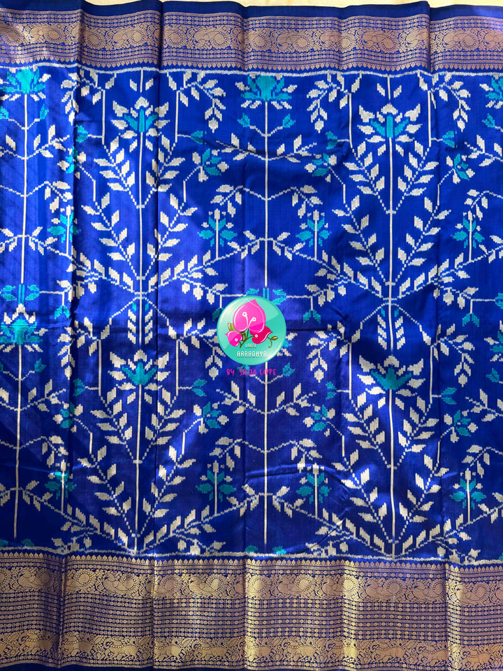 Sapphire Serenade: Royal Blue Ikkat Silk with Kanchi Heritage & Gilded Mirror Artistry