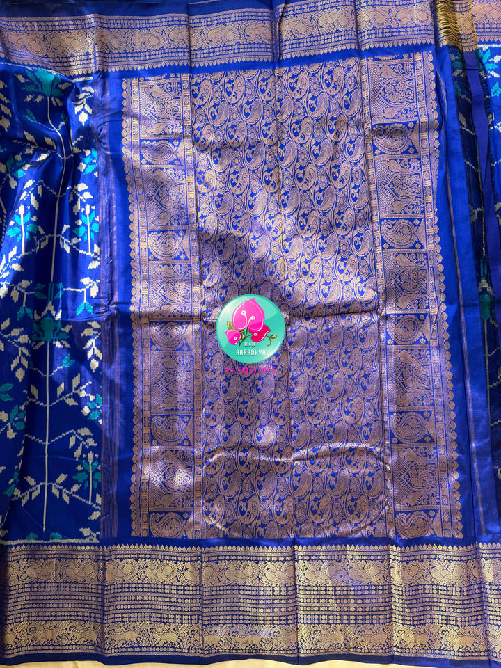 Sapphire Serenade: Royal Blue Ikkat Silk with Kanchi Heritage & Gilded Mirror Artistry