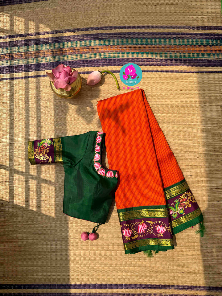 Fusion of Art & Weave: Tanjore Hand-Painted Kanchipattu Saree in Sunset Orange & Green