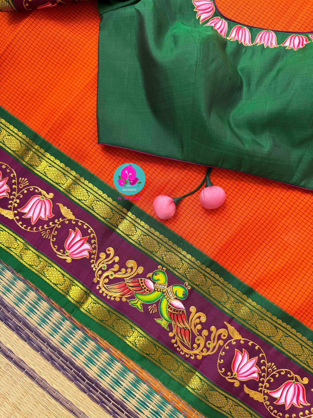 Fusion of Art & Weave: Tanjore Hand-Painted Kanchipattu Saree in Sunset Orange & Green