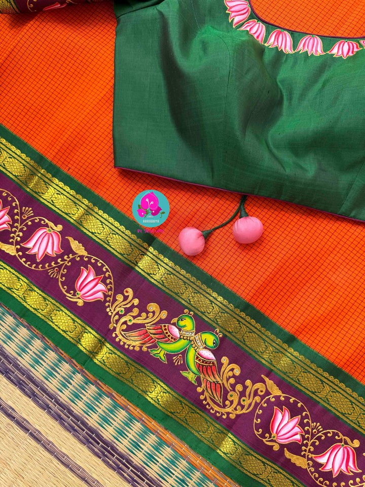 Fusion of Art & Weave: Tanjore Hand-Painted Kanchipattu Saree in Sunset Orange & Green