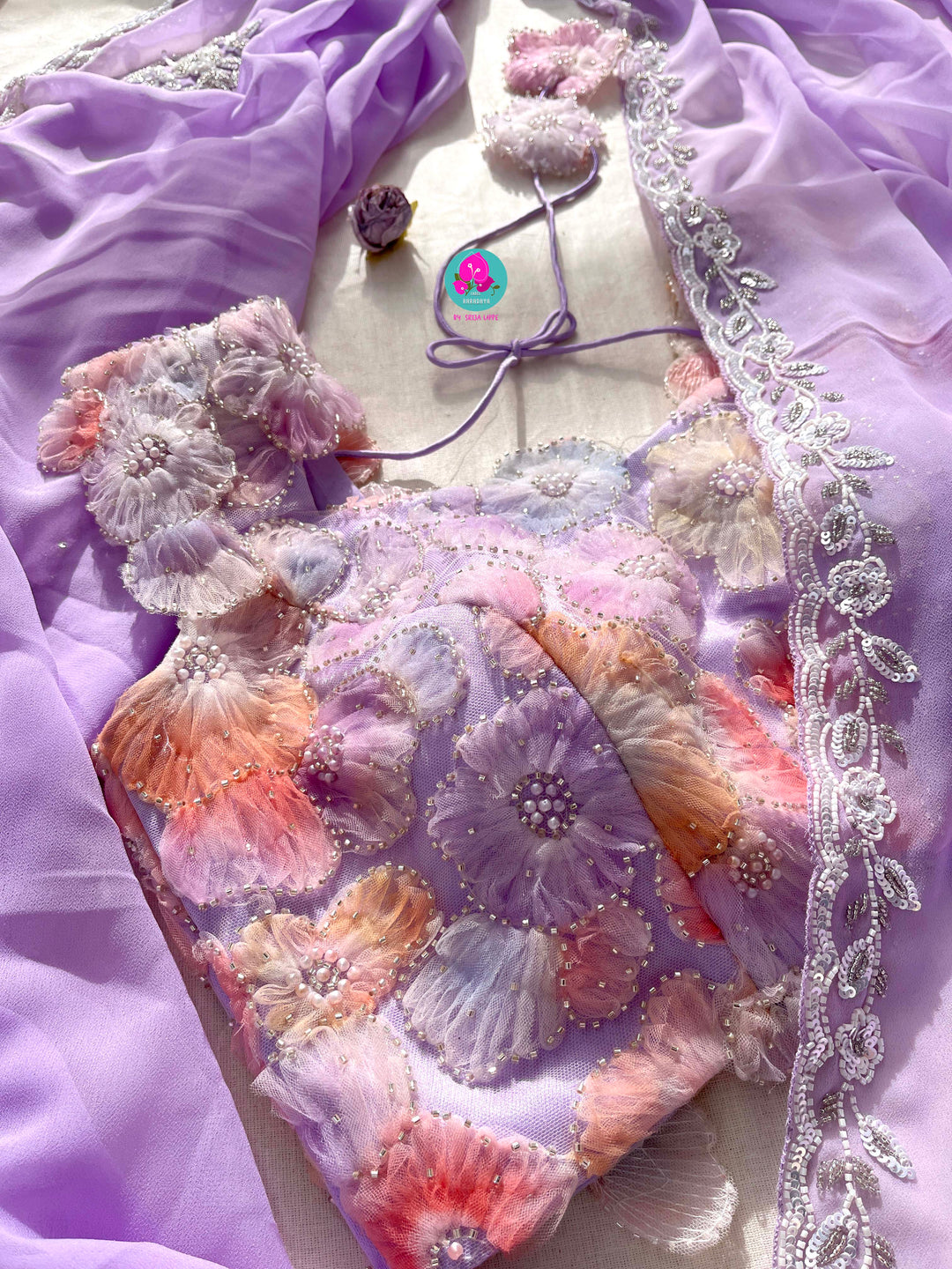 Hand embroidered georgette Lavender saree with Embellished Net Fashion Blouse