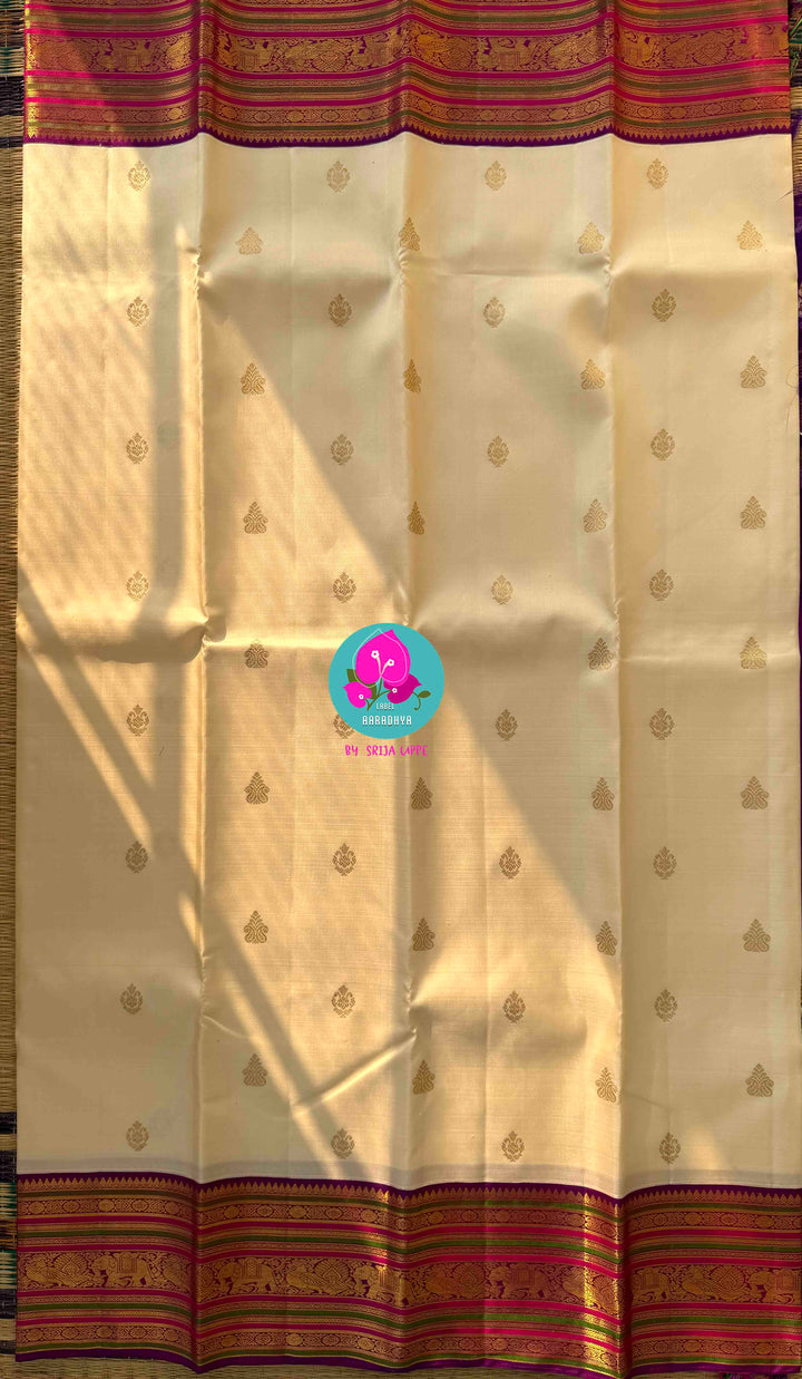 Ivory Radiance & Magenta Majesty: Handloom Kanchipattu with Meticulous Gold Artistry