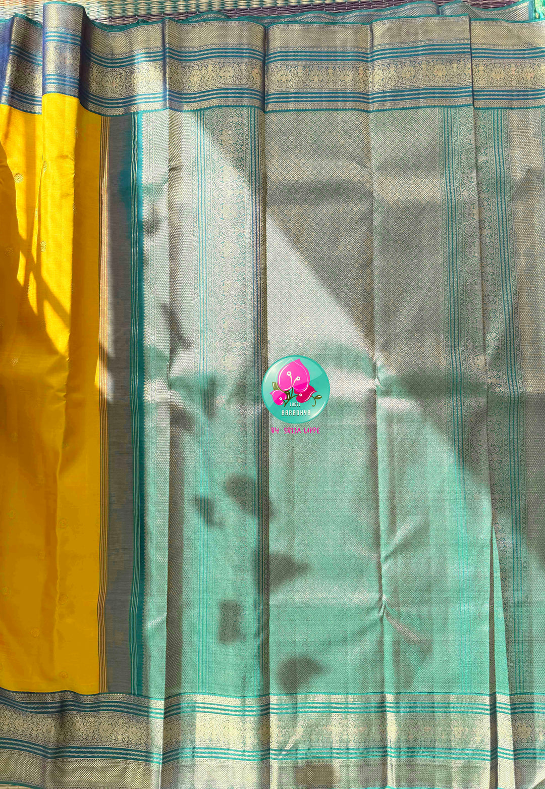 Vintage Radiance & High-Contrast Splendor: Mustard Yellow Pure Kanjeevaram Saree with Peacock Blue Border & Rani Pink Maggam Blouse