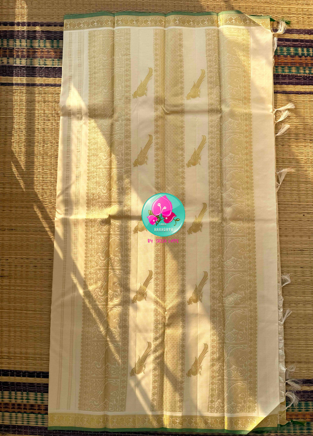 The Ivory Aviary: Off-White Vaira Oosi Kanchipattu Saree with Rangoli Artistry