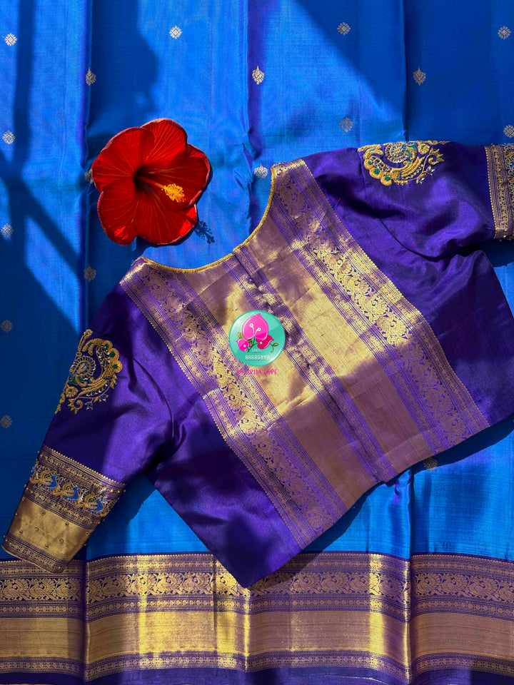 Regal Sapphire & Deep Indigo Elegance: Pure Sky-Blue Kanchipattu Saree with Deep Navy-Purple Border & Intricate Hand-Embroidered Maggam Blouse