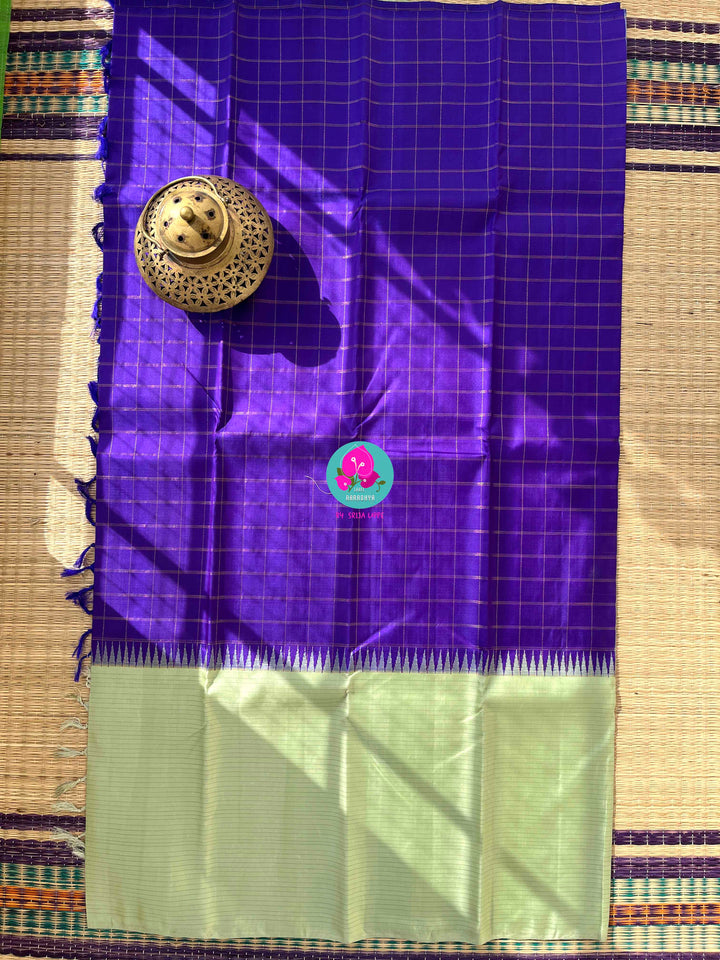 The Royal Jewel: Checkered Blue-Violet Silk Saree Paired with Hand-Embroidered Bird Blouse