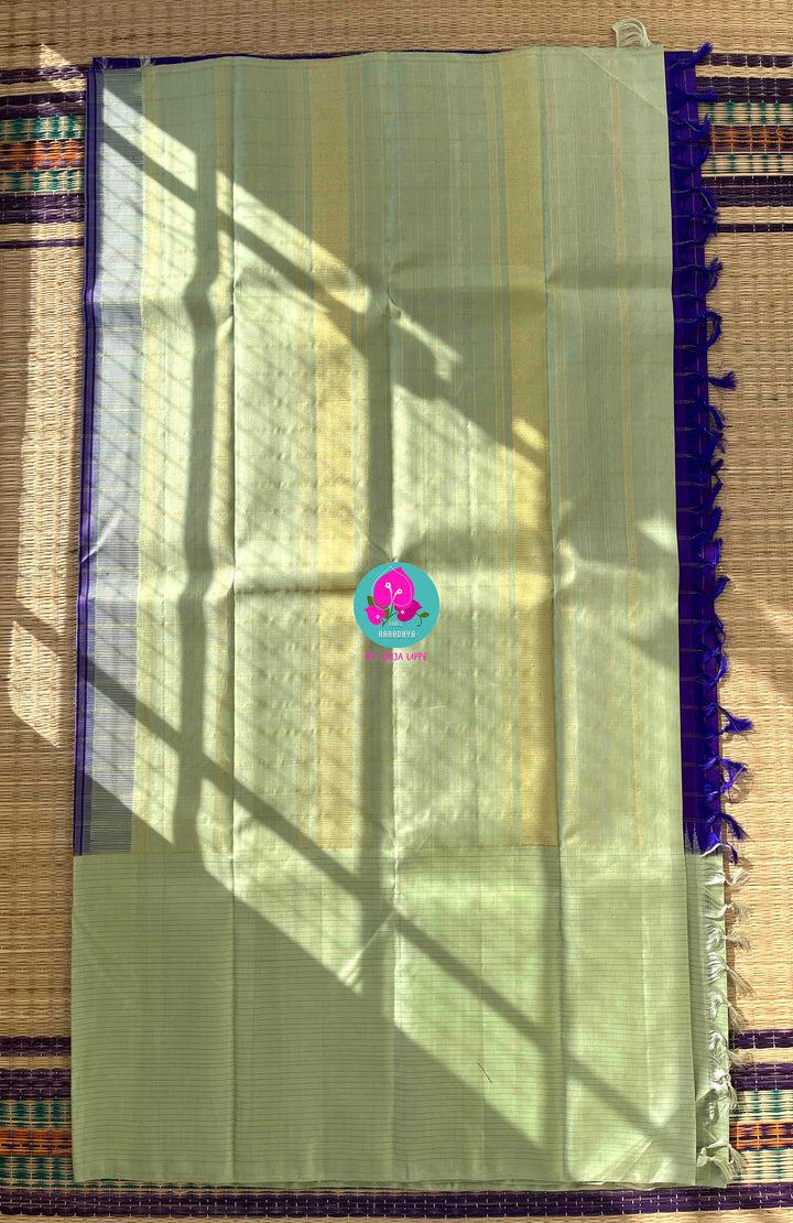 The Royal Jewel: Checkered Blue-Violet Silk Saree Paired with Hand-Embroidered Bird Blouse