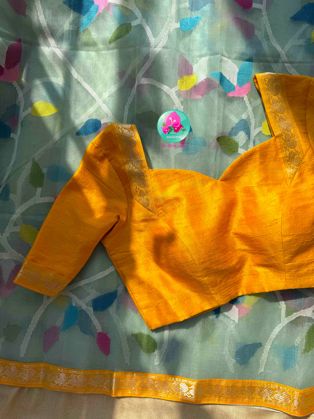 Ethereal Sheer Artistry: Powder Blue Jamdani-Kanchi Organza Silk Saree with Sunburst Mustard Raw Silk Blouse