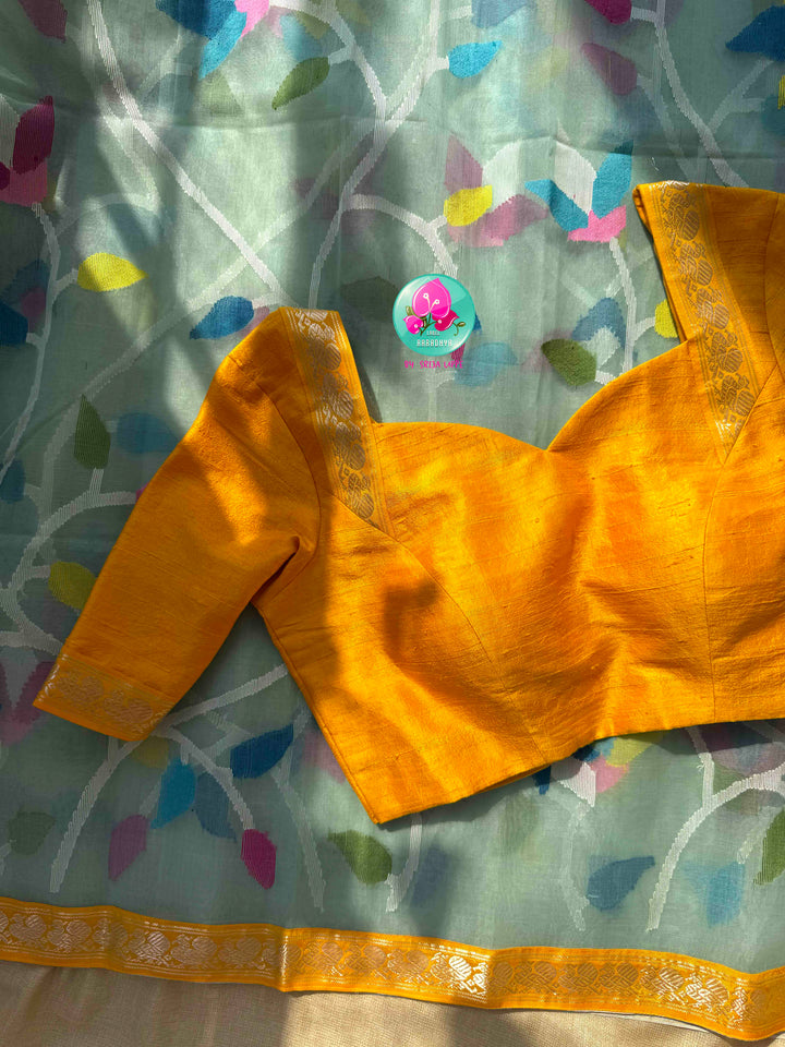 Ethereal Sheer Artistry: Powder Blue Jamdani-Kanchi Organza Silk Saree with Sunburst Mustard Raw Silk Blouse