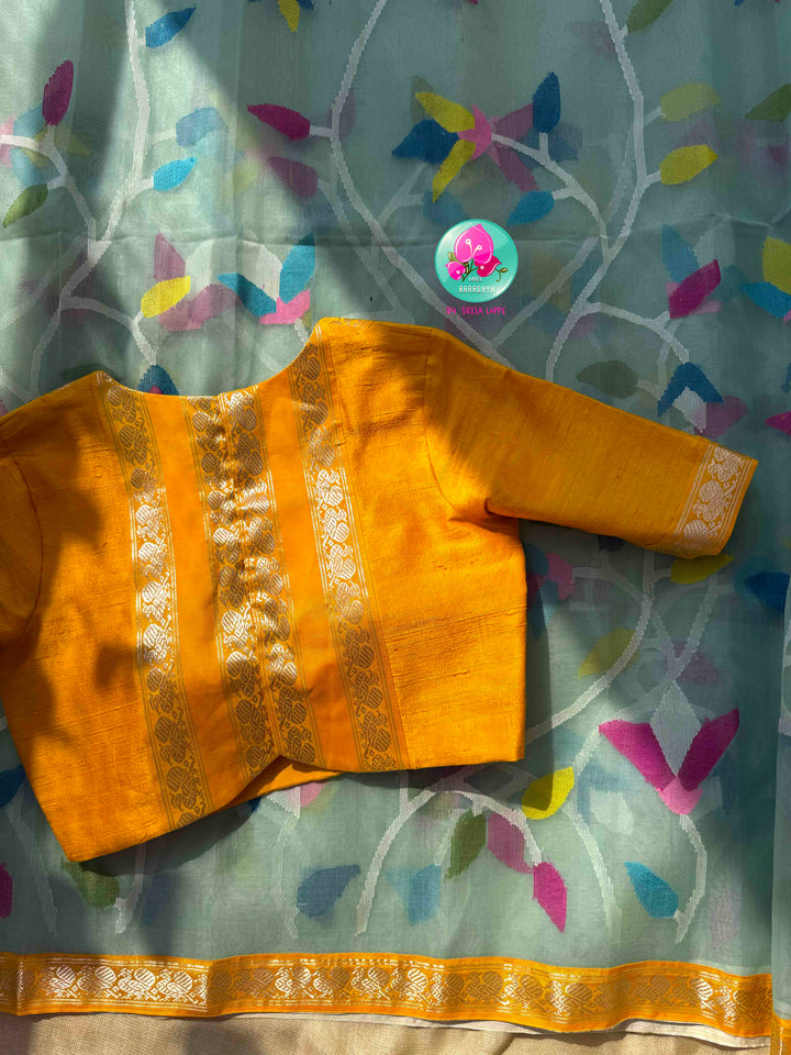 Ethereal Sheer Artistry: Powder Blue Jamdani-Kanchi Organza Silk Saree with Sunburst Mustard Raw Silk Blouse