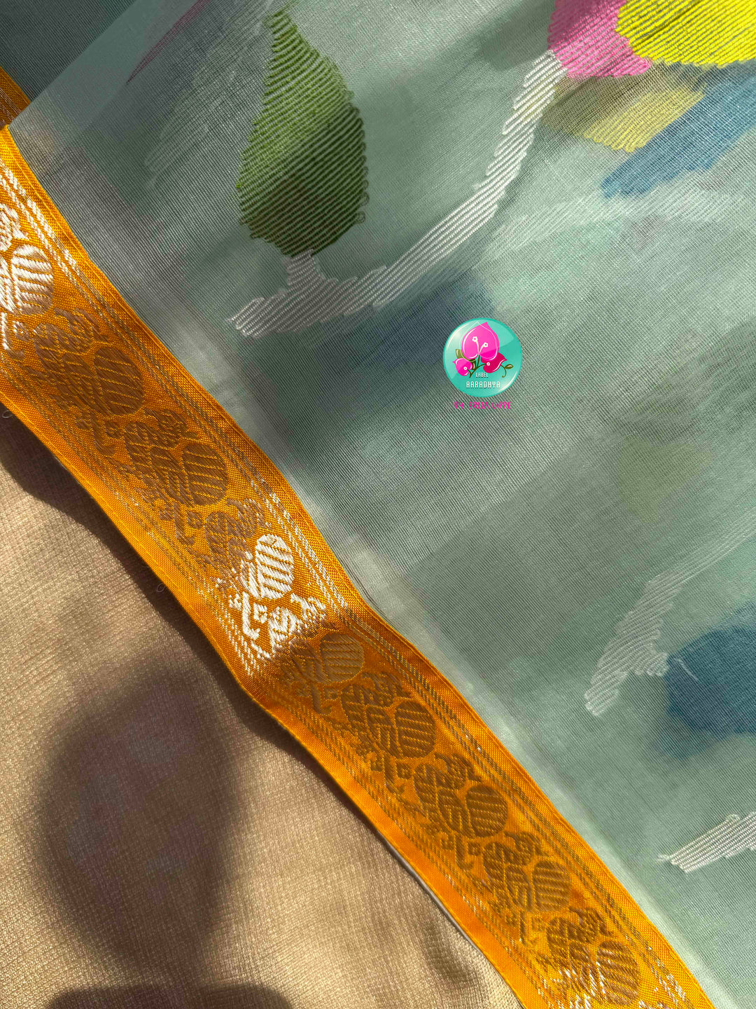 Ethereal Sheer Artistry: Powder Blue Jamdani-Kanchi Organza Silk Saree with Sunburst Mustard Raw Silk Blouse