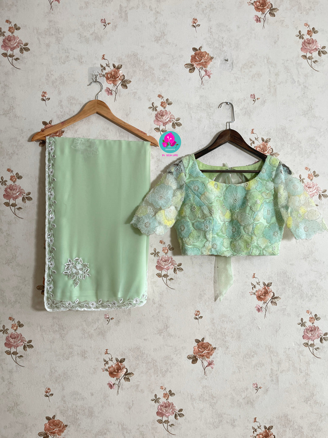 Hand embroidered georgette light Pista green saree with Embellished Net Fashion Blouse