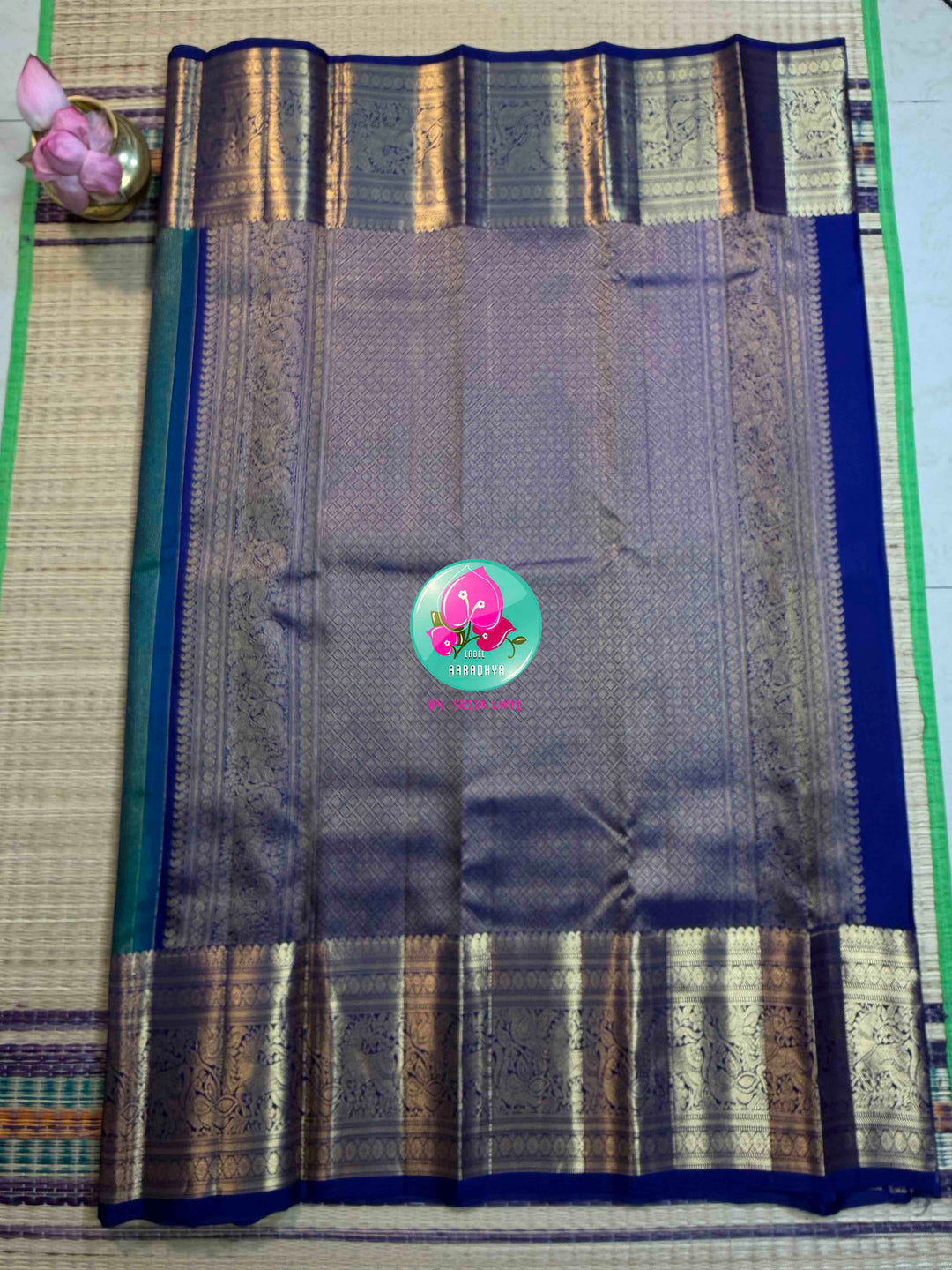 Gilded Peacock: Peacock Green Vaira Oosi Kanchipattu with Royal Blue Big Border