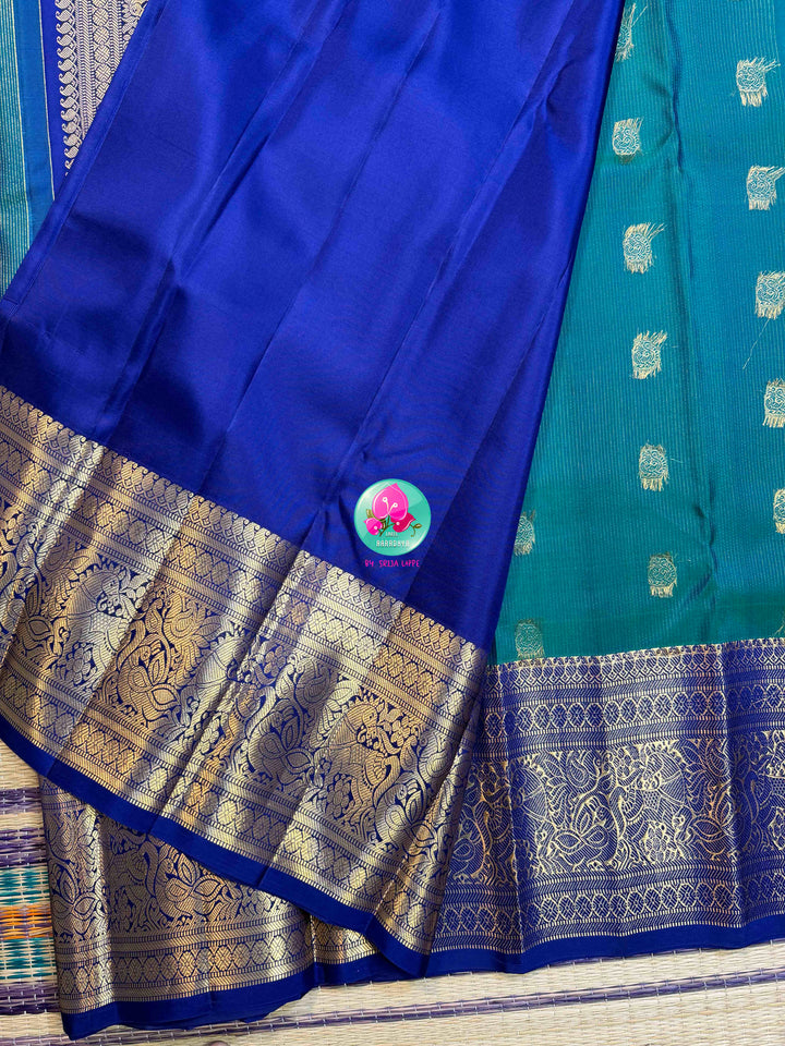Gilded Peacock: Peacock Green Vaira Oosi Kanchipattu with Royal Blue Big Border