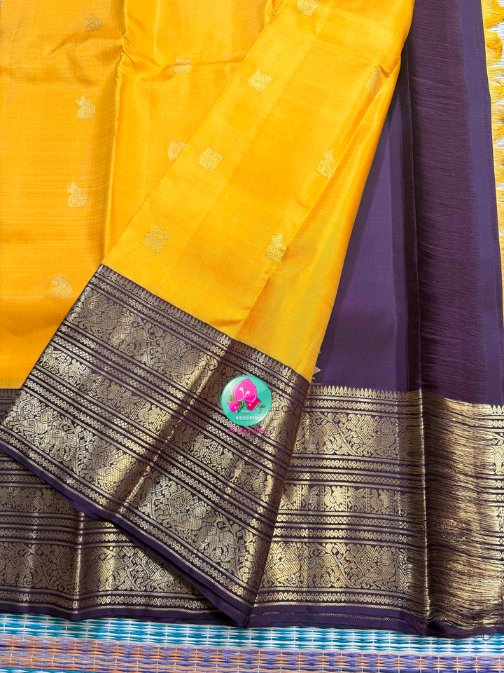 The Gilded Sun: Yellow 2G Pure Kanchipattu Saree with Earthen Brown & Sacred Motifs