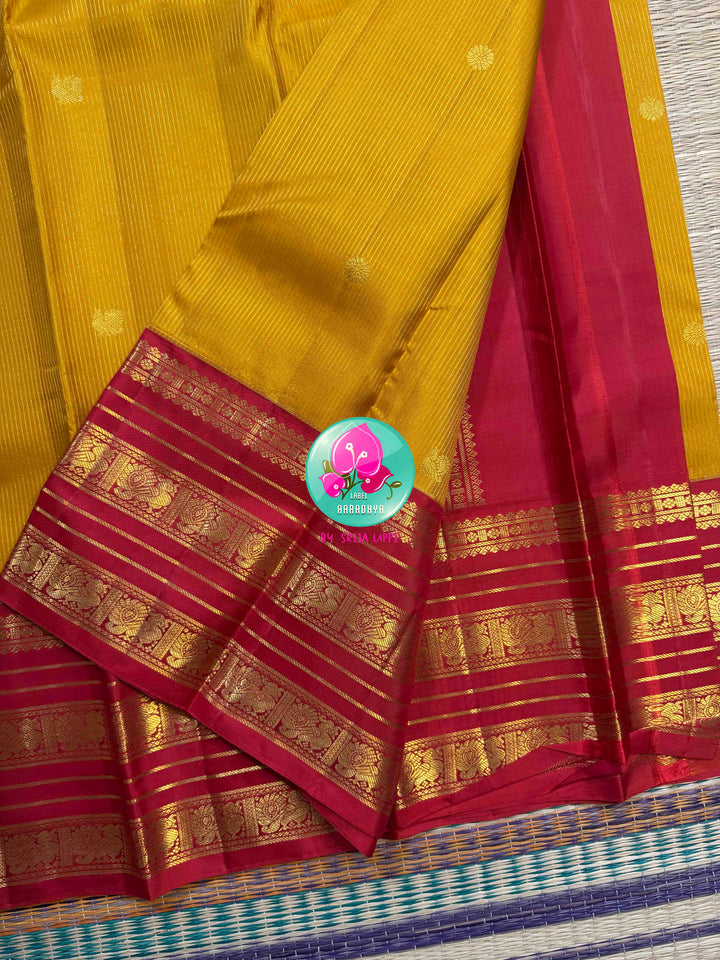 The Sacred Spark: Mustard Vaira Oosi Kanchipattu Saree with Grand Crimson Borders